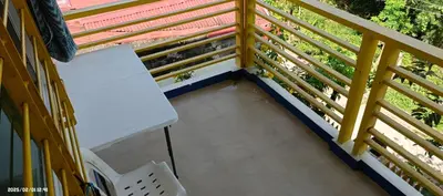 a balcony with a white bench on a building at Fazing in Bacoor