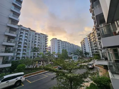 a parking lot in a city with tall buildings at 1BR Condo w Balcony near NAIA, Casino, Newport in Manila