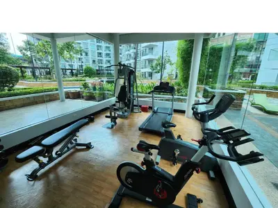 a gym with treadmills and ellipticals in a building at 1BR Condo w Balcony near NAIA, Casino, Newport in Manila