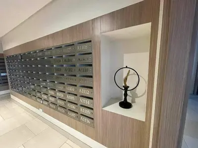 a wall with a bunch of wine glasses at Field Residences Condo Hotel Near Manila Airport in Manila