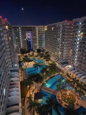 an aerial view of a resort at night at Executive Suite 519A at Shell Residence by GK Condotel in Manila