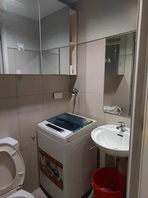 a small bathroom with a toilet and a sink at Suite 1443D at Shell Residence by GK Condotel in Manila