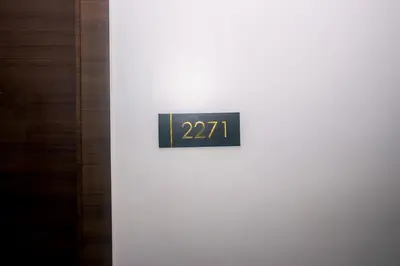 a clock on the side of a white wall at Cozy Crash Pad B Laughter friendly Makati 2271 Gym Swim Park 300 in Manila
