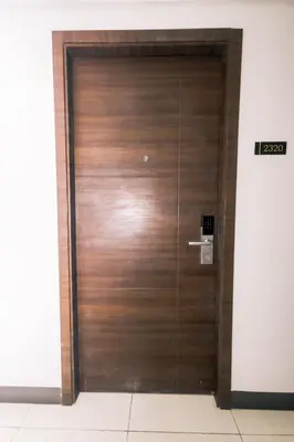 a wooden elevator door in a building at Hidden Gem Coolest Crash spot Makati Swim Gym Park 2320 in Manila