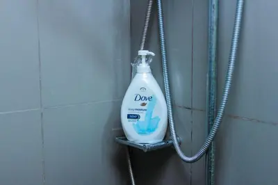 a bottle of detergent is hanging on a wall at Secret Makati Love Haven Swim Gym Park Laugh 300MB in Manila