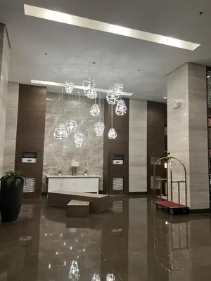 a lobby with a large room with a reception desk at Radiance Manila Bay in Manila