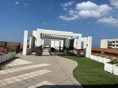 a building with a pavilion on the grass at BayFront 1BR Condo in Pasay with FREE Wi-Fi, Netflix, Pool Access & Gym, Near NAIA Airport, MOA, OKADA, CCP & PICC in Manila
