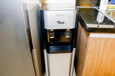 a trkk coffee machine sitting on top of a counter at BayFront 1BR Condo in Pasay with FREE Wi-Fi, Netflix, Pool Access & Gym, Near NAIA Airport, MOA, OKADA, CCP & PICC in Manila