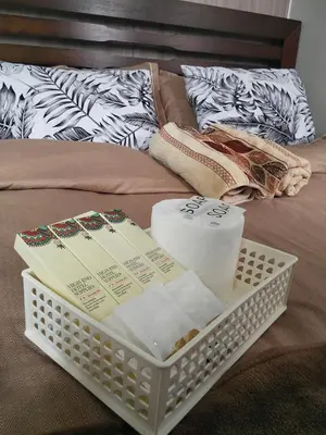 a tray with toilet paper and towels on a bed at VSV Luxury Family Suite staycation Moa shore2 tower2 unit1122 in Manila