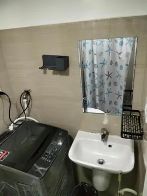 a bathroom with a sink and a mirror at VSV Luxury Family Suite staycation Moa shore2 tower2 unit 1122 in Manila