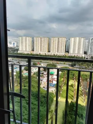 a view of a city from a balcony at VSV Luxury Family Suite staycation Moa shore2 tower2 unit 1122 in Manila