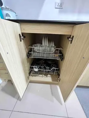 a drawer in a kitchen with dishes in it at D Crib at Breeze Residences Pasay City Philippines in Manila