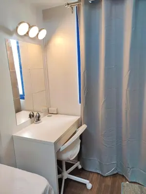 a bathroom with a sink and a shower curtain at Stunning 2BR Condo in AIR Residences Makati High Floor and WFH with 300Mbps Wifi in Manila