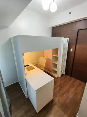 a room with a white desk and a bunk bed at Stunning 2BR Condo in AIR Residences Makati High Floor and WFH with 300Mbps Wifi in Manila