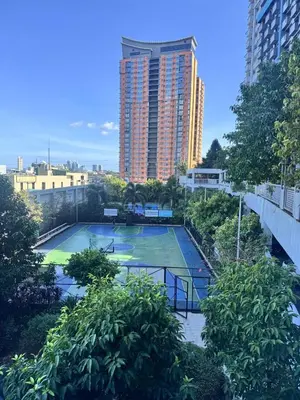 a tennis court in the middle of a city at 2 Bedroom with Balcony in Manila