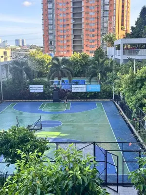 a tennis court in the middle of a city at 2 Bedroom with Balcony in Manila