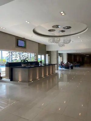 a lobby of a building with a check in counter at Sea Residences MOA Pasay City- Kirk in Manila