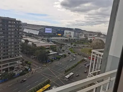 a view of a city with a street with cars at Shell Condotel MOA Pasay in Manila