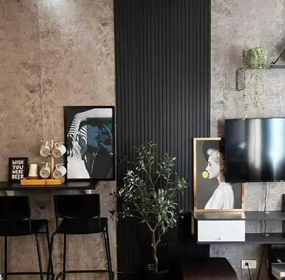 a living room with a tv and a table with chairs at Meraki Stays - ISLA - SMDC Hope Residences in Trece Martires