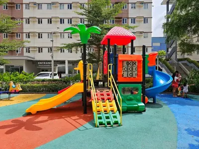 a playground with a slide in a park at Meraki Stays - ISLA - SMDC Hope Residences in Trece Martires