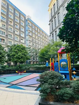 a playground in front of a large building at We Vibe, 81 Newport Blvd across NAIA 3 in Manila
