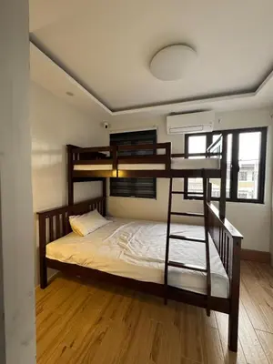 a bedroom with bunk beds in a room at Casa Mira in Dasmariñas
