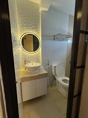 a bathroom with a sink and a toilet at Casa Mira in Dasmariñas