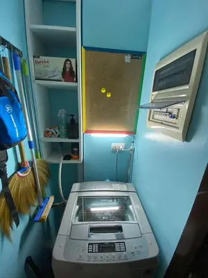 a small room with a desk with a printer at Cozy Home Right Across International Airport Terminal 3 in Manila