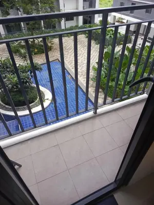 a view of a balcony with a pool at Jasmine Haven in Shore2 Residences in Manila