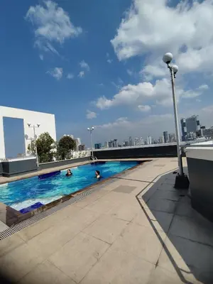 a swimming pool on the roof of a building at Yuanhang 910 in Manila