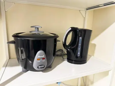 two appliances sitting on top of a shelf at Elegant 1 bedroom apartment with great facilities and perfect location in Manila