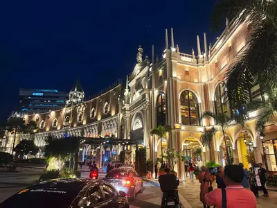 a building with cars parked in front of it at night at Elegant 1 bedroom apartment with great facilities and perfect location in Manila