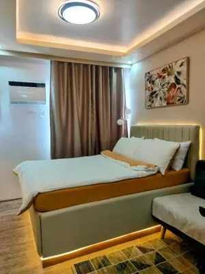 a small bedroom with a bed and a window at The Solace Place- Near Nuvali Sta Rosa Laguna in Bayabasan