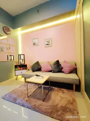 a living room with a couch and a coffee table at Casa Cashmere in Light residences at Mandaluyong City in Manila