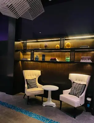 two chairs and a table in a room at Studio unit at The Milano Residences in Manila