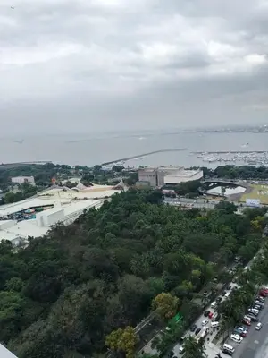 an aerial view of a city and the water at Affordable unit near MOA walking distance to picc in Manila