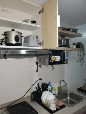 a kitchen with a sink and a microwave at 2019 Cavite Green 2 Condo Amenities HI Speed Wifi in Dasmariñas