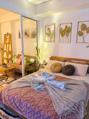 a bedroom with a bed with a ribbon on it at Maldives Tower Azure in Manila