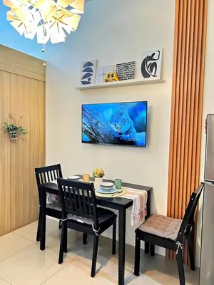 a dining room with a table and two chairs at Manila Bay, Seaside living near MOA, Studio unit in Manila