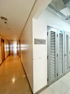 a hallway in a building with a sign on the wall at Manila Bay, Seaside living near MOA, Studio unit in Manila