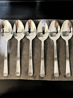 a group of spoons lined up in a row at Manila Bay, Seaside living near MOA, Studio unit in Manila
