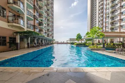 a swimming pool in the middle of a building at 1Br Suite w Balcony in Pasay - The Radiance Manila Bay in Manila