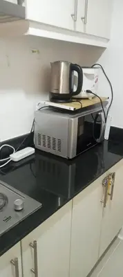 a toaster oven sitting on top of a kitchen counter at CHIC ROOM pasay sea residence in Manila