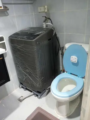 a bathroom with a blue toilet and a trash can at CHIC ROOM pasay sea residence in Manila