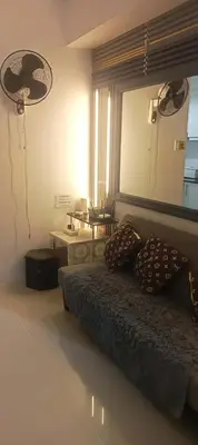 a bedroom with a bed and a mirror on the wall at CHIC ROOM pasay sea residence in Manila