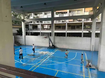 a group of people playing basketball on a basketball court at Modern Japanese Resort-Type Condo in Manila