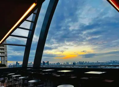 a view of a city skyline with tables and chairs at EDSA Cozy 3BR near MRT w Netflix and Karaoke Fun in Manila