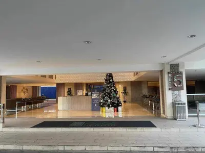 a christmas tree in the middle of a building at Field Residences Hotel Apartments Near Manila Airport in Manila