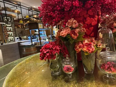 a group of vases filled with flowers on a table at Large Family Groups in Air residence Makati Gym Swim Park 300 mbps in Manila
