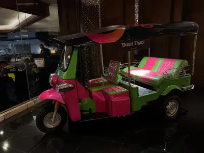 a pink and green golf cart parked in a mall at Large Family Groups in Air residence Makati Gym Swim Park 300 mbps in Manila